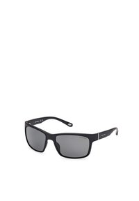 Gafas de sol polarizadas negras con montura cuadrada, lentes grises, acabado mate, varillas delgadas y un sutil logo en las patillas.