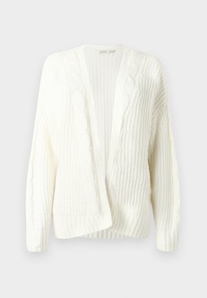 Bela pletena jopica z vzorčastim reliefnim vzorcem in obliko pletenic, odprti sprednji del ter rebrastim robom in manšetami. Mehki in lahki material.