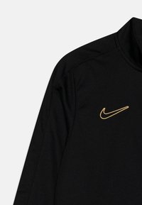 Nike Performance DF ACD23 SUIT UNISEX - Træningssæt - black/metallic gold