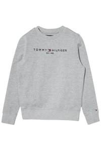 Felpa grigia in cotone con maniche lunghe, polsini e scollo a costine. Presenta il logo "TOMMY HILFIGER" e l'anno di fondazione 1985 in nero.