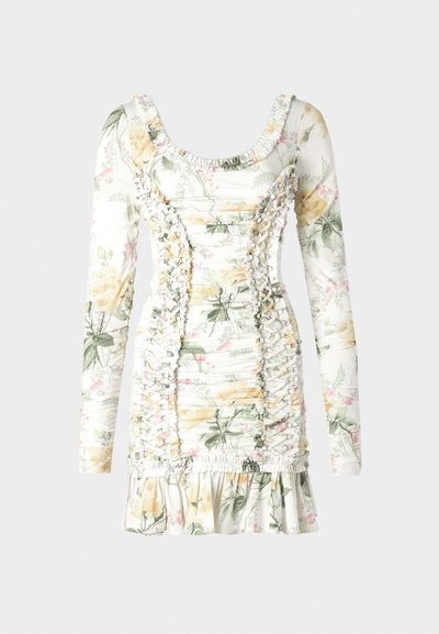 Cvečni mini obleki v beli barvi z rumenimi in roza vzorci. Ima dolge rokave, oprijet silhueto in nabranino ob straneh.