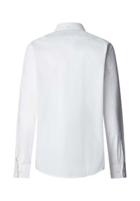 Chemise blanche à manches longues avec poignets boutonnés et col boutonné vue de dos sur un fond blanc uni.