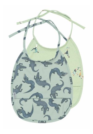 Two children's bibs: one green with alligator pattern, the other light green with sports figures, both featuring adjustable ties.