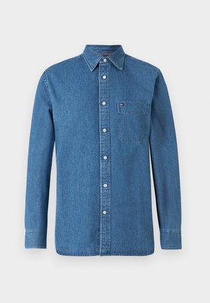 Denim shirt in blue, featuring a button-down collar, long sleeves, front button placket, and a chest pocket with logo accent.
