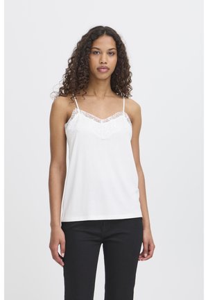 White camisole with lace trim at the neckline and shoulders. Fabric is soft with a smooth texture. Adjustable spaghetti straps.