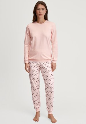 Hellsrosa Langarmshirt kombiniert mit pinken Schlafanzughosen mit floralem Muster. Beides aus weichem Stoff mit gerippten Bündchen an Handgelenken und Knöcheln.
