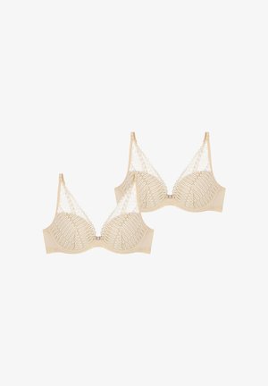 Beige bh'er med gennemsigtig blondeoverdel, der har et indviklet ovalmønster, justerbare stropper og hægte- og øjeknap foran.