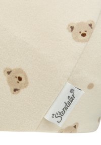 Beige fabric with small, light brown teddy bear faces pattern and a white fabric tag with "Sterntaler" logo in black script.