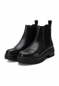 Carmela Botines con plataforma - black