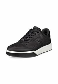 Sneaker in pelle nera con finitura liscia, design perforato sulla punta, lacci neri e suola in gomma bianca per contrasto.