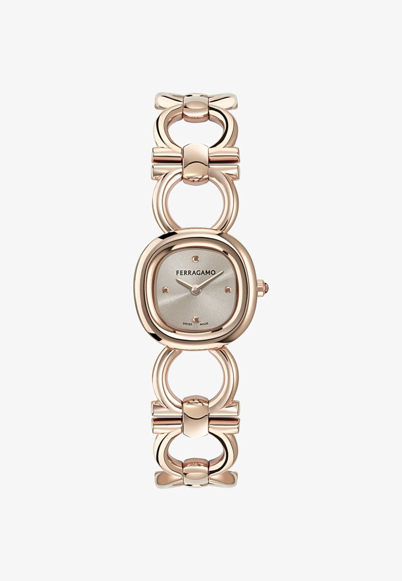 Náramkové hodinky Ferragamo z růžového zlata se čtvercovým stříbrným ciferníkem, minimalistickým číselníkem a propojenými kruhovými a mašličkovými články na pásku.
