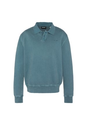 Bluza polo z długim rękawem w wyblakłym kolorze teal, z prążkowanymi mankietami, ściągaczem, plastronem z dwoma guzikami oraz małym haftowanym logo na lewej piersi.