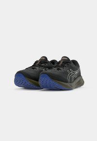 Sport shoes with a black mesh upper, brown laces, and white accents, featuring a blue rubber sole and textured tread pattern.