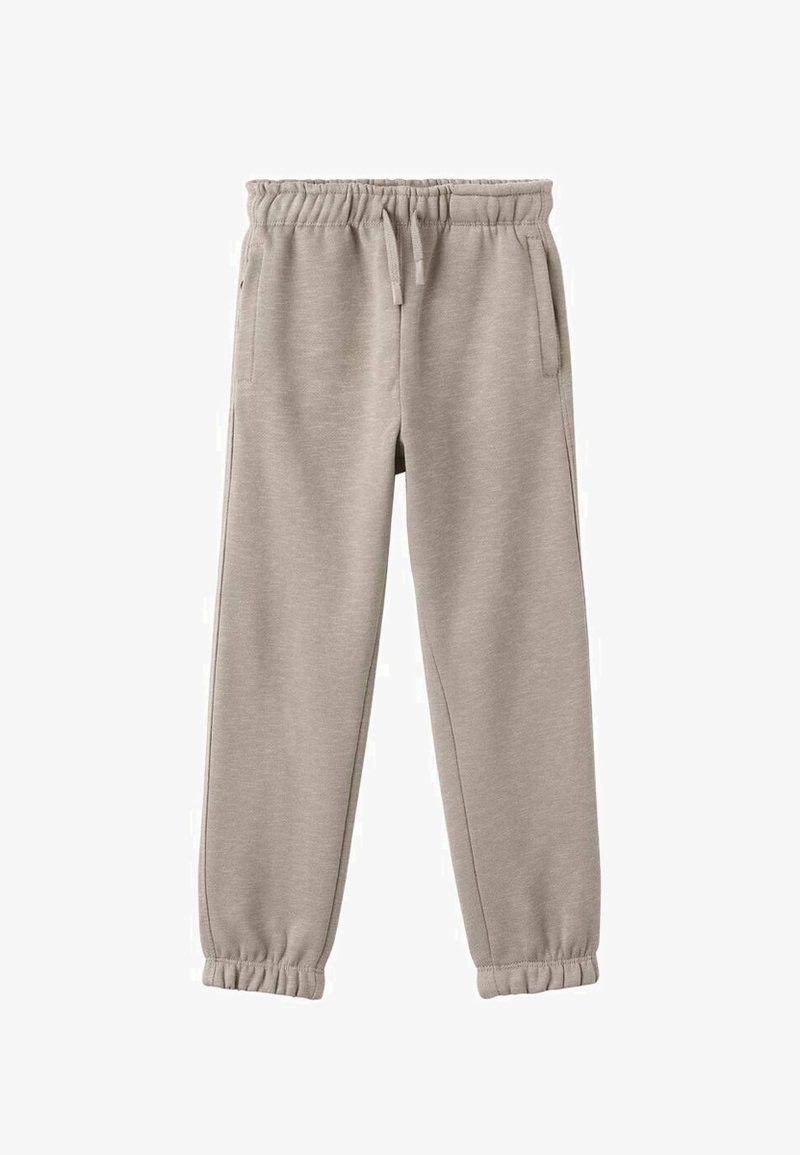 Svetlo bež trenirke iz mehkega materiala, z elastičnim pasom in vrvico, ter z nabranimi manšetami na gležnjih.