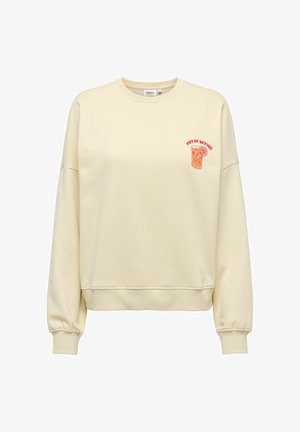 Sweat-shirt crème à manches longues, avec poignets et ourlet côtelés, arborant un petit graphisme de boisson orange et le texte "OUT OF OFFICE" sur la poitrine.