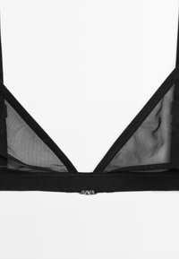 Black bralette featuring mesh material, V-shaped design, adjustable straps, and a small metallic clasp at the back.