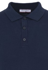 Polo bleu marine à manches courtes avec trois boutons et une étiquette "Felix Hardy" au col en taille M.