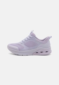 Light purple athletic shoe with mesh panels, cushioned sole, and lace-up design. Features a smooth texture and a logo on the side.