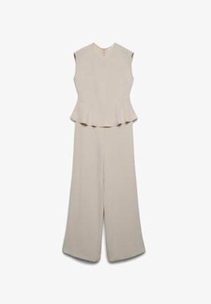 Tuta beige senza maniche con scollo rotondo, dettaglio vita con peplo, pantaloni a gamba larga e chiusura posteriore con cerniera.