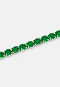 Green gemstone bracelet with square-cut stones set in silver metal, showcasing a uniform design and glossy finish.