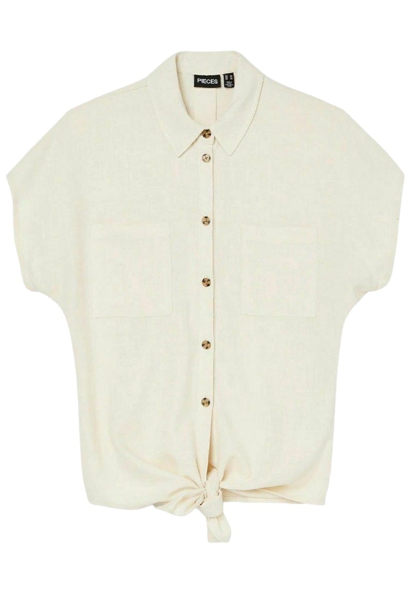 Short-sleeve beige shirt with a button-up front, two chest pockets, and a knotted hem detail. Made from lightweight, textured fabric.
