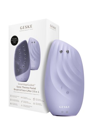 Brosse faciale électrique de couleur lavande et appareil de lifting facial présentés à côté de leur boîte blanche avec les caractéristiques du produit et le branding.