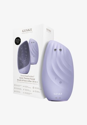 Brosse faciale électrique de couleur lavande et appareil de lifting facial présentés à côté de leur boîte blanche avec les caractéristiques du produit et le branding.