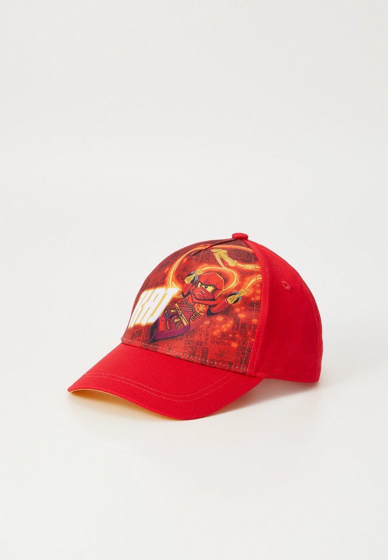 Red baseball cap featuring a colorful graphic of a character on the front, with a flat brim and soft fabric construction.