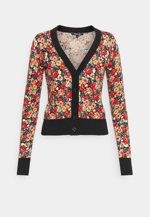 Cardigan à manches longues boutonné avec bordure noire, à motif dense de fleurs rouges, orange, jaunes et blanches sur un fond sombre.