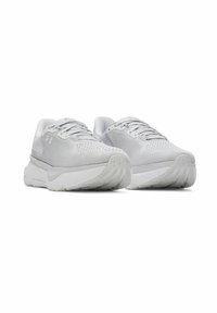 Light gray athletic shoes with mesh upper, padded tongue, and thick white sole; textured patterns on lace area and rubber outsole.