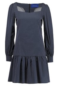 Vestido de lunares azul marino con escote cuadrado, mangas abullonadas y dobladillo con volantes. Hecho de tela liviana, con cremallera en la parte posterior.