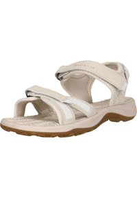 Valkoiset säädettävät sandaalit, joissa on keinomateriaali, avoin muotoilu, teksturoitu pohja ja pehmeä, vaahtomuovipohjallinen. Korostettu kevyellä ompeleella.