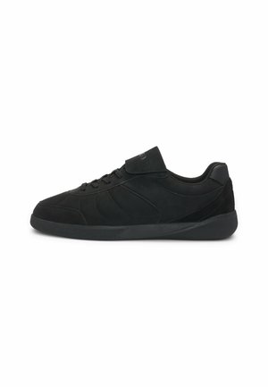 Black low-top sneaker with lace-up front and padded collar, featuring subtle stitching and a flat rubber sole.