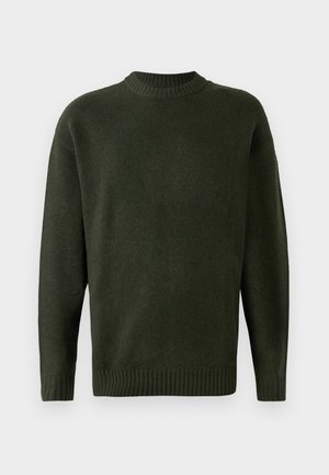 Mørkegrøn uldtrøje med ribbet rund halsudskæring, lange ærmer og ribbet kant forneden. Blød tekstur, ensfarvet, ingen mønstre eller udsmykninger.