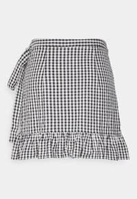 Falda de cuadrícula en blanco y negro con un lazo en la cintura y un dobladillo acampanado. Fabricada con un tejido ligero, de corte A clásico.