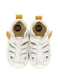 Zapatos blancos para niños pequeños con patrones de dinosaurios azules, que cuentan con un diseño flexible, correa ajustable y suelas texturizadas para un mejor agarre.