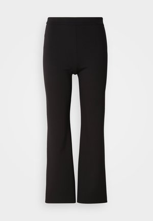 Schwarze, ausgestellte Hosen aus einem glatten, elastischen Stoff. Hoher Bund, eng an den Hüften und ab den Knien weit geschnitten.