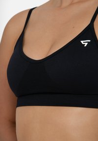 SQUATPROOF LEGACY SEAMLESS STRAP BACK  - Sport-bh met light support - black