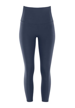 Felső derekú, sötétkék leggings, rugalmas, sima anyagból; testhez álló sziluett, bokáig érő dizájn és varrás nélküli kivitel.
