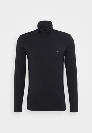 Svart langermet genser med høy hals laget av et glatt, elastisk stoff. Har en liten, subtil logo på brystområdet.