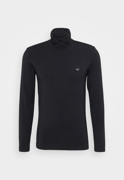 Juodas ilgomis rankovėmis golfo marškinėliai, pagaminti iš lygaus, tampraus audinio. Ant krūtinės yra mažas, subtilus logotipas.