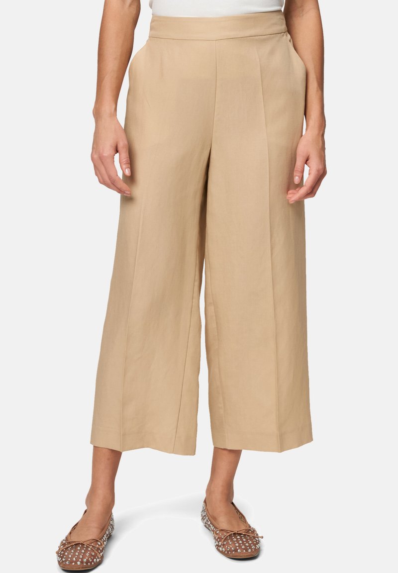 Beige wide-leg trousers with a high waistband, made from a soft fabric. Features a smooth texture and structured pleats for a tailored look.