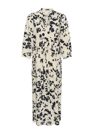 Longue robe crème à imprimé floral noir, manches bouffantes trois-quarts, encolure ronde et détail noué devant avec ouverture en forme de goutte.