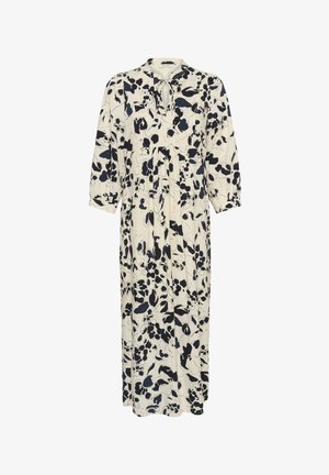 Hosszú krémszínű ruha fekete virágmintával, háromnegyedes, puffos ujjakkal, kerek nyakkivágással, és elöl kulcslyuk alakú megkötővel.