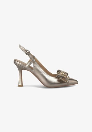 Metallic silver high-heeled slingback shoe with a pointed toe, embellished bow detail, and a mid-heel with a square base. Smooth texture.