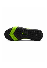 Semelle noire en caoutchouc texturé, avec un accent vert et le logo Nike. Le design comprend un motif en zigzag pour une meilleure adhérence.