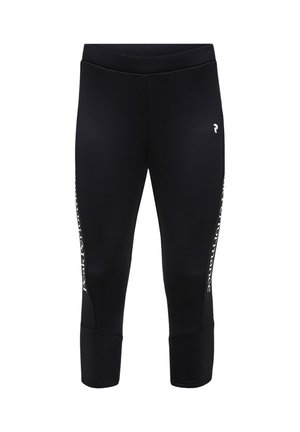 Leggings sportivi neri a vita alta con logo bianco sulla coscia sinistra e testo verticale bianco lungo i lati esterni di entrambe le gambe.
