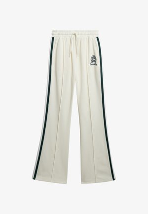Pantalones de chándal color crema con un diseño de pierna ancha, que presentan franjas verde oscuro a los lados y un logo bordado en la cadera.