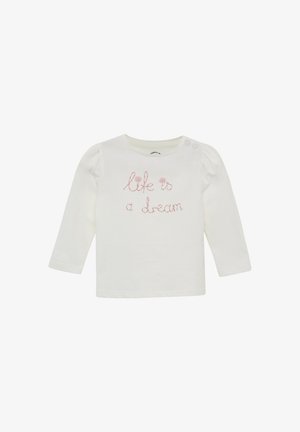 Witte babytrui met lange mouwen en roze geborduurde tekst "leven is een droom" en twee knopen op de linkerschouder.