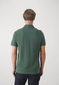 Lacoste Pólóing - vert fonce